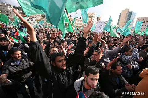 Hamas supporters take part in a rally celebrating the 25th anniversary of the founding of the Islamist mouvement, on December 14, 2012, in the West Bank city of Hebron. The rally is the first time that the West Bank's ru...