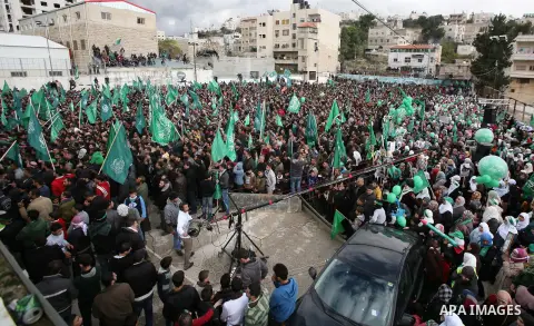 Hamas supporters take part in a rally celebrating the 25th anniversary of the founding of the Islamist mouvement, on December 14, 2012, in the West Bank city of Hebron. The rally is the first time that the West Bank's ru...