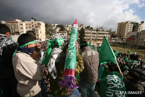 Hamas supporters take part in a rally celebrating the 25th anniversary of the founding of the Islamist mouvement, on December 14, 2012, in the West Bank city of Hebron. The rally is the first time that the West Bank's ru...
