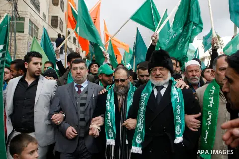 Hamas supporters take part in a rally celebrating the 25th anniversary of the founding of the Islamist mouvement, on December 14, 2012, in the West Bank city of Hebron. The rally is the first time that the West Bank's ru...
