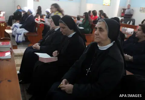 Palestinian Christians attend a prayers at the Latin Catholic Church in Gaza City, Sunday, Dec. 16, 2012. Twal arrived in Gaza on Sunday to attend a celebration with Palestinians ahead of Christmas. Photo by Majdi Fathi