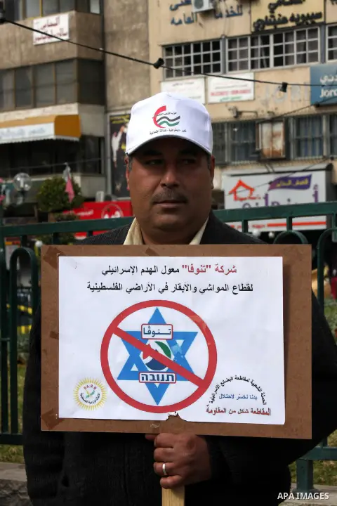 Palestinians demonstrate against the Paris Protocol and the Oslo Agreement, both key accords which govern economic ties between Palestinians and Israelis, and ask for the boycott of Israeli products in Nablus in the occu...