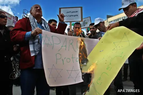 Palestinians demonstrate against the Paris Protocol and the Oslo Agreement, both key accords which govern economic ties between Palestinians and Israelis, and ask for the boycott of Israeli products in Nablus in the occu...