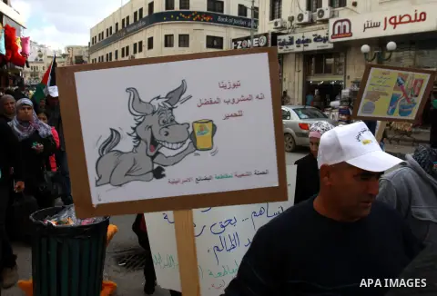 Palestinians demonstrate against the Paris Protocol and the Oslo Agreement, both key accords which govern economic ties between Palestinians and Israelis, and ask for the boycott of Israeli products in Nablus in the occu...