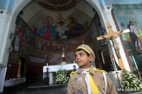 Palestinians celebrate during visiting Latin Patriarch of Jerusalem Fouad Twal in Gaza City, Sunday, Dec. 16, 2012. Twal arrived in Gaza on Sunday to attend a celebration with Palestinians ahead of Christmas. Photo by As...