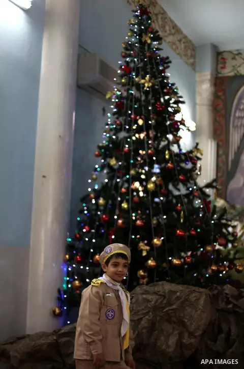 Palestinians celebrate during visiting Latin Patriarch of Jerusalem Fouad Twal in Gaza City, Sunday, Dec. 16, 2012. Twal arrived in Gaza on Sunday to attend a celebration with Palestinians ahead of Christmas. Photo by As...