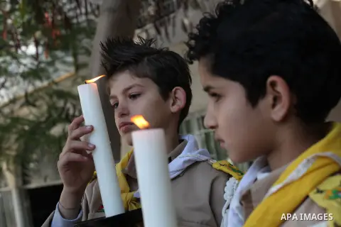 Palestinians celebrate during visiting Latin Patriarch of Jerusalem Fouad Twal in Gaza City, Sunday, Dec. 16, 2012. Twal arrived in Gaza on Sunday to attend a celebration with Palestinians ahead of Christmas. Photo by As...