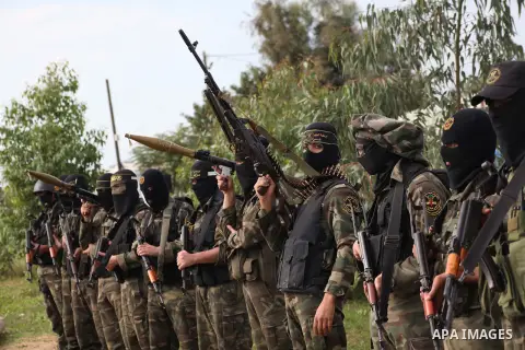 Palestinian militants from al-Quds Brigades the armed wing of the Islamic Jihad organization, stand during military exercises at an undisclosed location in the Hamas-run Gaza Strip in Gaza city on Dec 16. 2012. Hamas' ar...