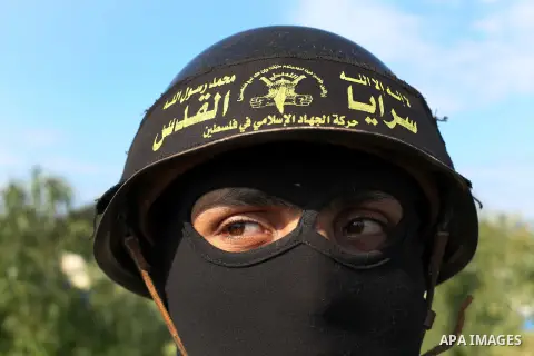 A Palestinian militant from al-Quds Brigades the armed wing of the Islamic Jihad organization, stands during military exercises at an undisclosed location in the Hamas-run Gaza Strip in Gaza city on Dec 16. 2012. Hamas'...