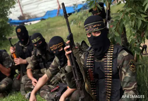 Palestinian militants from al-Quds Brigades the armed wing of the Islamic Jihad organization, sit during military exercises at an undisclosed location in the Hamas-run Gaza Strip in Gaza city on Dec 16. 2012. Hamas' arme...