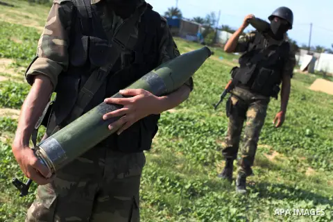 Palestinian militants from al-Quds Brigades the armed wing of the Islamic Jihad organization, carry rockets during military exercises at an undisclosed location in the Hamas-run Gaza Strip in Gaza city on Dec 16. 2012. H...