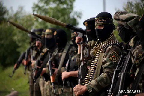 Palestinian militants from al-Quds Brigades the armed wing of the Islamic Jihad organization, stand during military exercises at an undisclosed location in the Hamas-run Gaza Strip in Gaza city on Dec 16. 2012. Hamas' ar...
