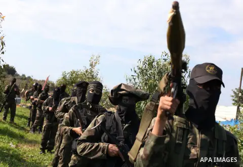 Palestinian militants from al-Quds Brigades the armed wing of the Islamic Jihad organization, stand during military exercises at an undisclosed location in the Hamas-run Gaza Strip in Gaza city on Dec 16. 2012. Hamas' ar...