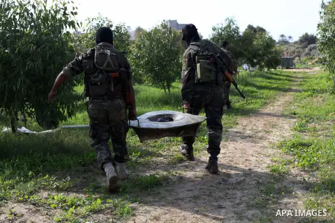 Palestinian militants from al-Quds Brigades the armed wing of the Islamic Jihad organization, carry a rocket launcher during military exercises at an undisclosed location in the Hamas-run Gaza Strip in Gaza city on Dec 1...