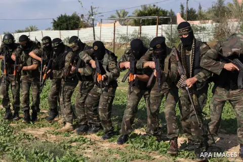 Palestinian militants from al-Quds Brigades the armed wing of the Islamic Jihad organization, walk during military exercises at an undisclosed location in the Hamas-run Gaza Strip in Gaza city on Dec 16. 2012. Hamas' arm...