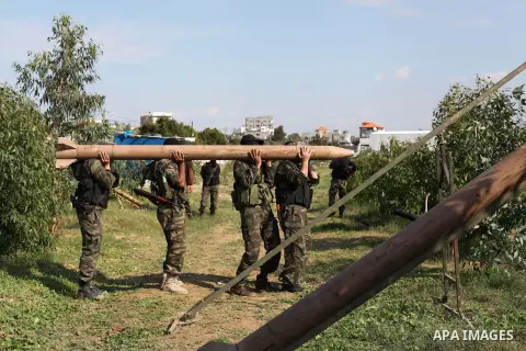 Palestinian militants from al-Quds Brigades the armed wing of the Islamic Jihad organization, carry a rocket during military exercises at an undisclosed location in the Hamas-run Gaza Strip in Gaza city on Dec 16. 2012....