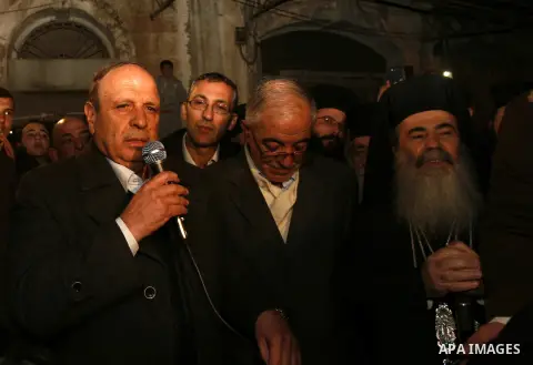 Greek Orthodox Patriarch of Jerusalem Theophilos III celebrates the lighting of the Christmas tree in the old city of Jerusalem, on December 16, 2012. Photo by Mahfouz Abu Turk