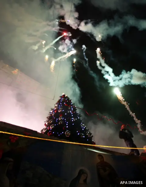 Fireworks is seen during the celebration ahead of Christmas near Jerusalem's Old City December 16, 2012. Photo by Mahfouz Abu Turk