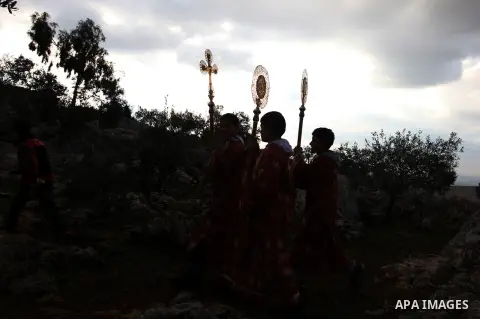 Palestinian Orthodox Christians return from the nearby ancient monastery of St. Barbara to the Palestinian village of Abud, in the Israeli occupied West Bank, during a parade to celebrate the annual festival of St. Barba...