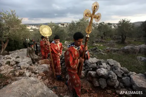 Palestinian Orthodox Christians return from the nearby ancient monastery of St. Barbara to the Palestinian village of Abud, in the Israeli occupied West Bank, during a parade to celebrate the annual festival of St. Barba...