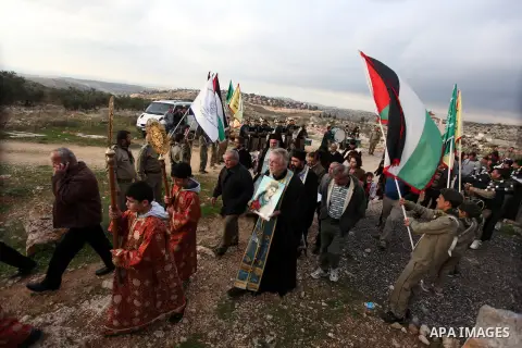 Palestinian Orthodox Christians return from the nearby ancient monastery of St. Barbara to the Palestinian village of Abud, in the Israeli occupied West Bank, during a parade to celebrate the annual festival of St. Barba...