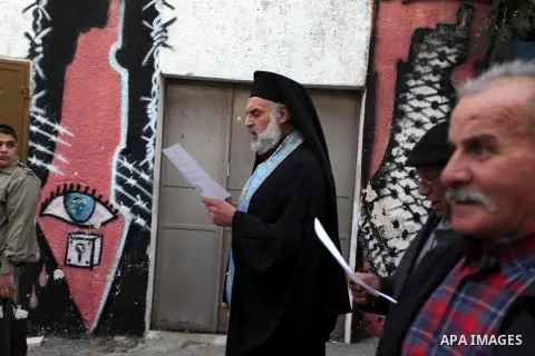 Palestinian Orthodox Christians return from the nearby ancient monastery of St. Barbara to the Palestinian village of Abud, in the Israeli occupied West Bank, during a parade to celebrate the annual festival of St. Barba...