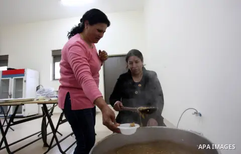 Palestinian women make traditional sweets to mark the annual festival of St. Barbara's Day in the Palestinian village of Abud, in the Israeli occupied West Bank on December 16, 2012. Photo by Issam Rimawi