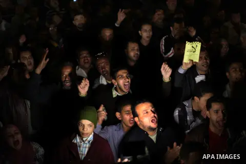 Protesters opposing Egypt's President Mohamed Mursi shout slogans as they demonstrate in front of the presidential palace in Cairo December 18, 2012. Opponents of Mursi staged protests in Cairo on Tuesday against an Isla...