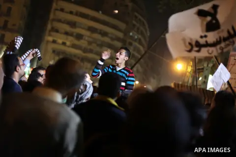 Protesters opposing Egypt's President Mohamed Mursi shout slogans as they demonstrate in front of the presidential palace in Cairo December 18, 2012. Opponents of Mursi staged protests in Cairo on Tuesday against an Isla...