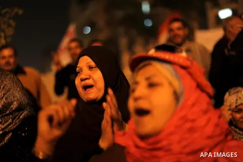 Protesters opposing Egypt's President Mohamed Mursi shout slogans as they demonstrate in front of the presidential palace in Cairo December 18, 2012. Opponents of Mursi staged protests in Cairo on Tuesday against an Isla...