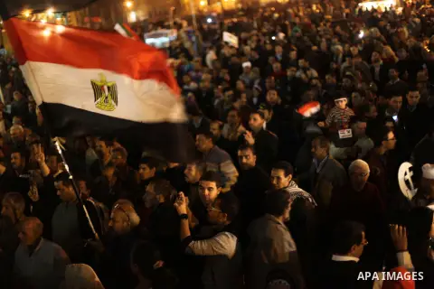 Protesters opposing Egypt's President Mohamed Mursi shout slogans as they demonstrate in front of the presidential palace in Cairo December 18, 2012. Opponents of Mursi staged protests in Cairo on Tuesday against an Isla...