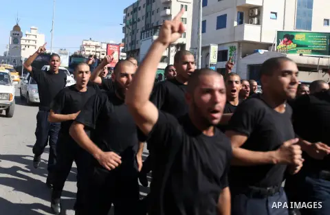 Palestinian Hamas policemen run during training exercises in Gaza city on 19 December 2012. Photo by Majdi Fathi