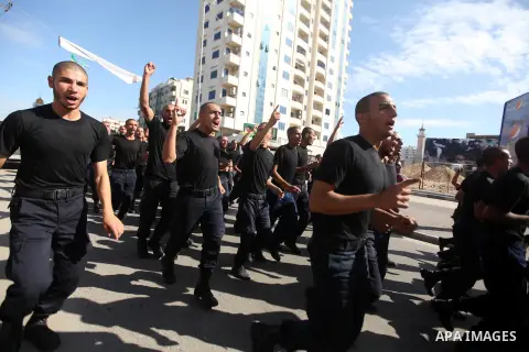 Palestinian Hamas policemen run during training exercises in Gaza city on 19 December 2012. Photo by Majdi Fathi