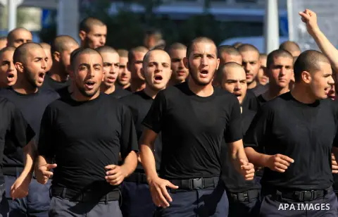 Palestinian Hamas policemen run during training exercises in Gaza city on 19 December 2012. Photo by Majdi Fathi
