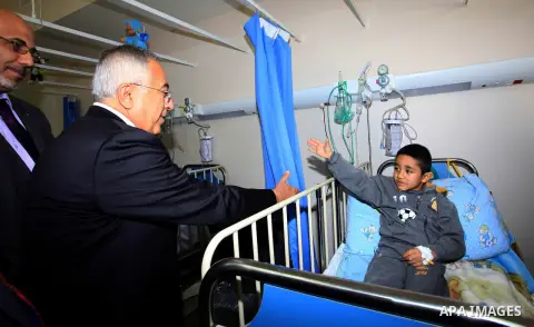 Palestinian Prime Minister Salam Fayyad attends the opining of department of Obstetrics in Thabet hospital in the West Bank city of Tulkarm on 19 December 2012. Photo by Mustafa Abu Dayeh
