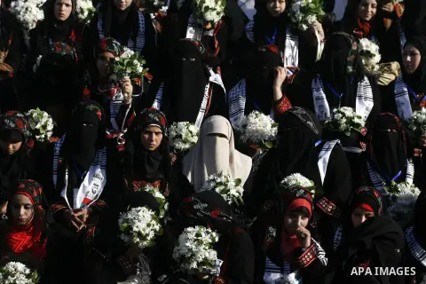 Palestinian brides pose during a mass wedding ceremony in Rafah southern Gaza strip, on December 19, 2012. The mass wedding organized by National Islamic Committee and funding by the institution of Sheikh Khalifa bin Zay...