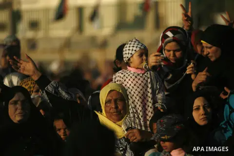 Palestinians attend a mass wedding ceremony in Rafah southern Gaza strip, on December 19, 2012. The mass wedding organized by National Islamic Committee and funding by the institution of Sheikh Khalifa bin Zayed bin Al N...