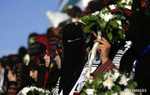 Palestinian brides pose during a mass wedding ceremony in Rafah southern Gaza strip, on December 19, 2012. The mass wedding organized by National Islamic Committee and funding by the institution of Sheikh Khalifa bin Zay...