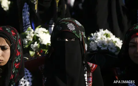 Palestinian brides pose during a mass wedding ceremony in Rafah southern Gaza strip, on December 19, 2012. The mass wedding organized by National Islamic Committee and funding by the institution of Sheikh Khalifa bin Zay...