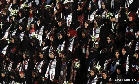 Palestinian brides pose during a mass wedding ceremony in Rafah southern Gaza strip, on December 19, 2012. The mass wedding organized by National Islamic Committee and funding by the institution of Sheikh Khalifa bin Zay...