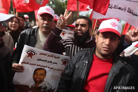 Supporters of the Popular Front for the Liberation of Palestine (PFLP) chant slogans during a demonstration in support of Palestinian prisoners held in Israeli jails, some of whom are observing a hunger strike, in Gaza c...