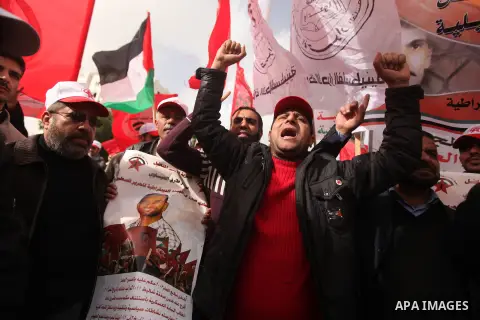 Supporters of the Popular Front for the Liberation of Palestine (PFLP) chant slogans during a demonstration in support of Palestinian prisoners held in Israeli jails, some of whom are observing a hunger strike, in Gaza c...