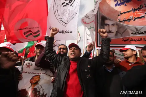 Supporters of the Popular Front for the Liberation of Palestine (PFLP) chant slogans during a demonstration in support of Palestinian prisoners held in Israeli jails, some of whom are observing a hunger strike, in Gaza c...
