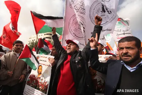 Supporters of the Popular Front for the Liberation of Palestine (PFLP) chant slogans during a demonstration in support of Palestinian prisoners held in Israeli jails, some of whom are observing a hunger strike, in Gaza c...