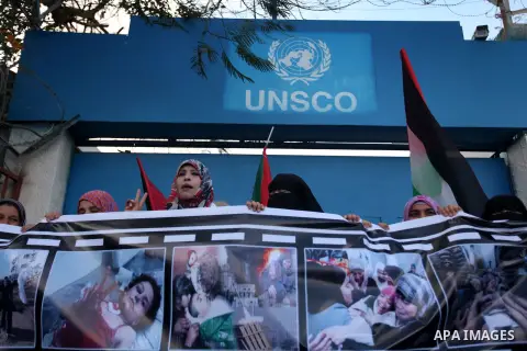 Palestinian women chant slogans during a protest calling for stop against women violence by Israeli forces in Gaza City, on Dec. 20, 2012. Photo by Majdi Fathi
