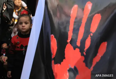 Palestinian women chant slogans during a protest calling for stop against women violence by Israeli forces in Gaza City, on Dec. 20, 2012. Photo by Majdi Fathi