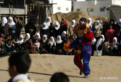 Palestinian children play during a leisure trip in Rafah refugee camp southern Gaza strip, on Dec. 20, 2012. The conflict between Israel and Gaza militant groups has claimed the lives of at least 23 children and Hundreds...