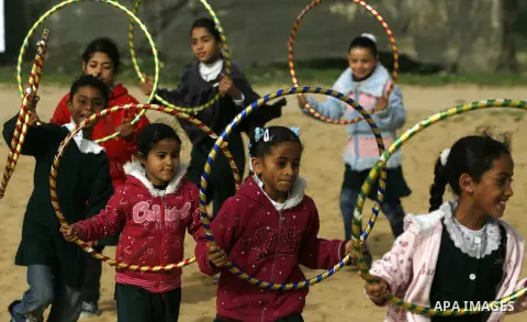 Palestinian children play during a leisure trip in Rafah refugee camp southern Gaza strip, on Dec. 20, 2012. The conflict between Israel and Gaza militant groups has claimed the lives of at least 23 children and Hundreds...