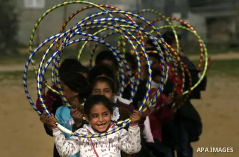 Palestinian children play during a leisure trip in Rafah refugee camp southern Gaza strip, on Dec. 20, 2012. The conflict between Israel and Gaza militant groups has claimed the lives of at least 23 children and Hundreds...
