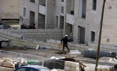 Labourers work at the construction site of a new housing project at the Jewish settlement of Kiryat Moreh in south Jerusalem on December 20, 2012. Israel has approved plans to build 523 homes in the West Bank, Jewish set...